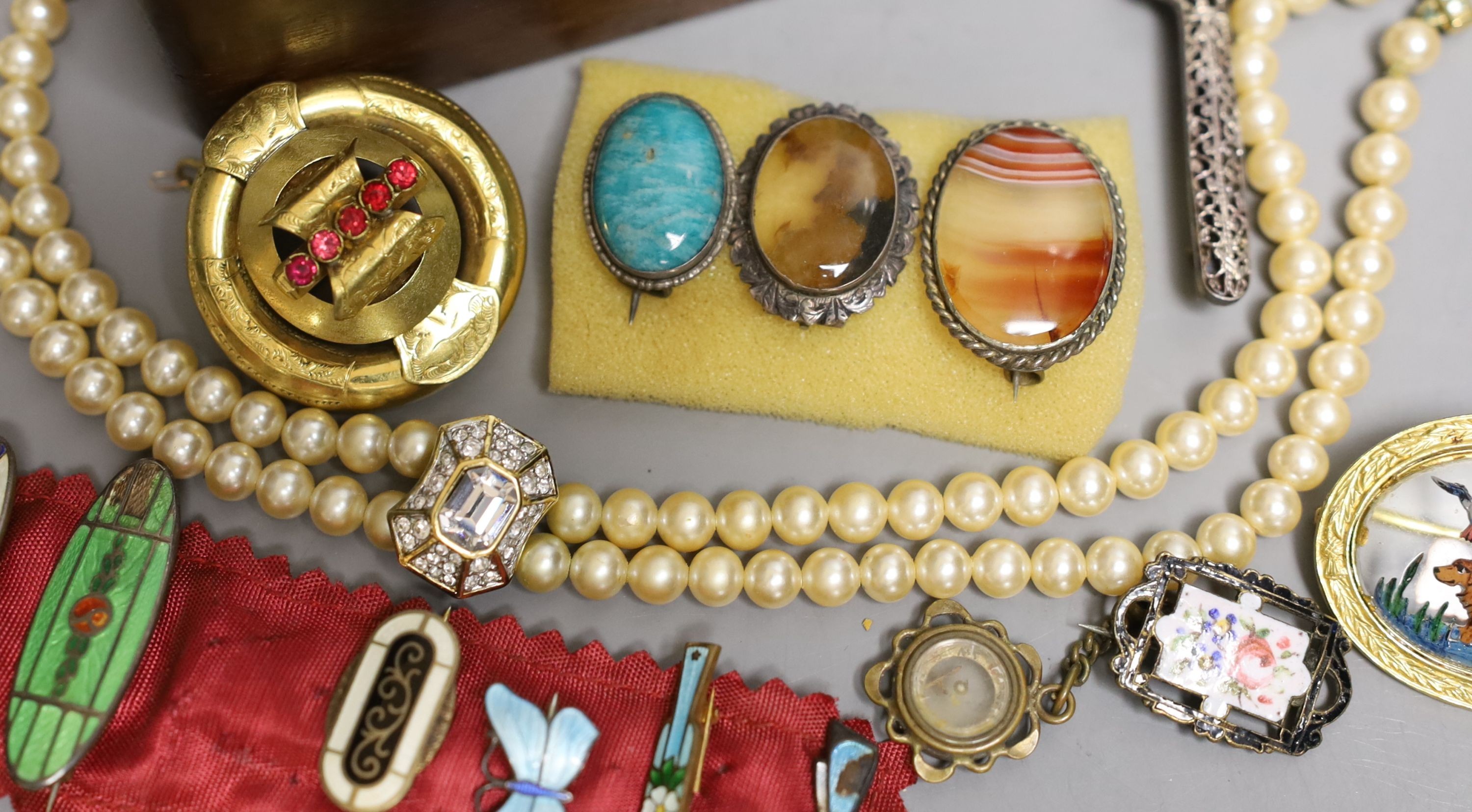 A Victorian pinchbeck and paste set brooch and a group of assorted costume jewellery including enamel.